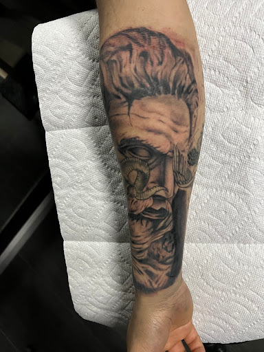Find music symbol tattoo ideas for your next unique tattoo in Lakeville at Savage Ink