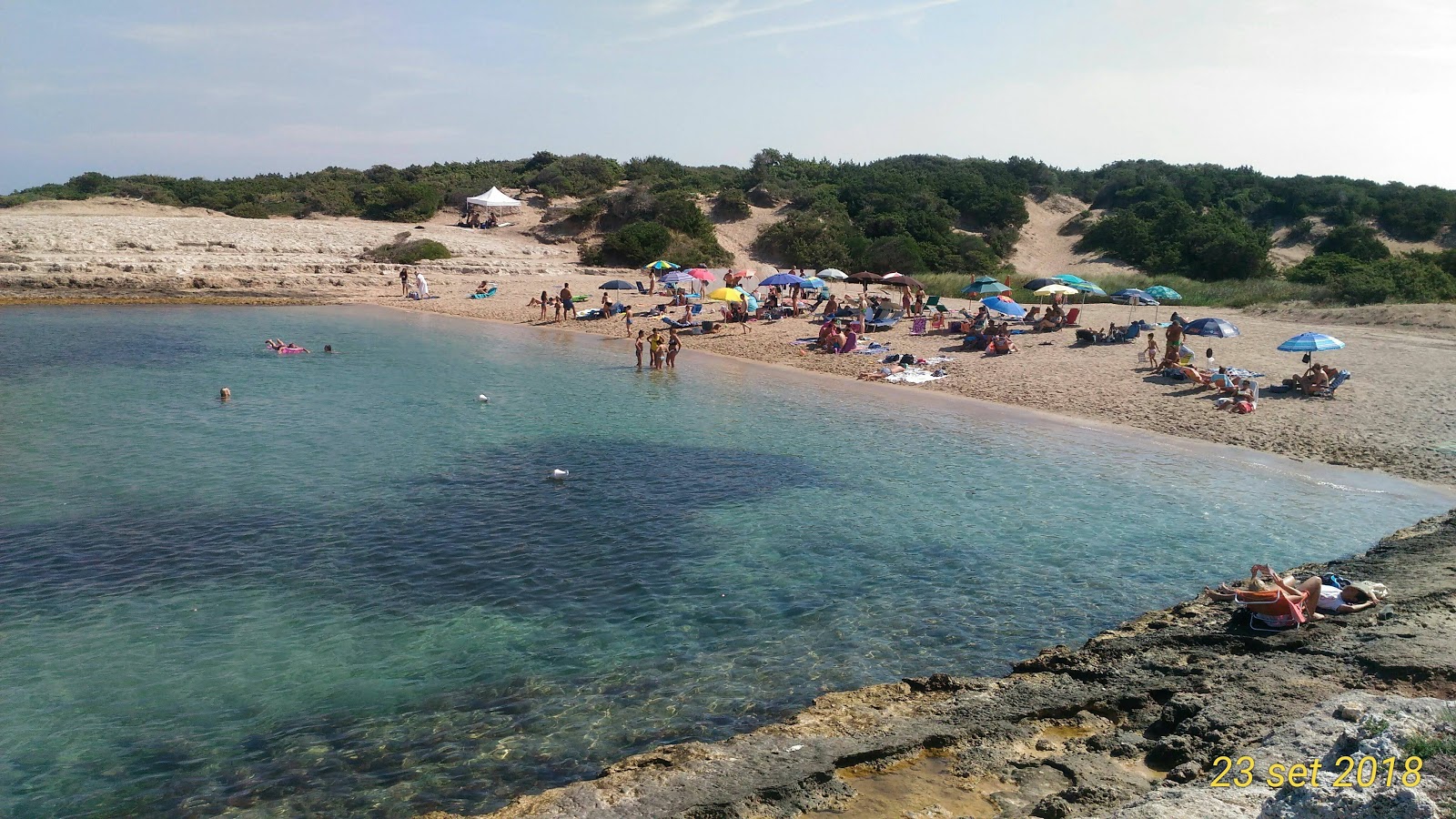 Spiaggia di Torre Pozzelle'in fotoğrafı mavi saf su yüzey ile
