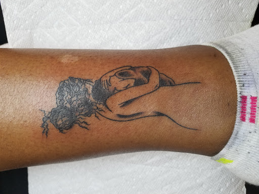 Explore dominican flag tattoo ideas, creative tattoo ideas in Carbondale, available at Bomber Crew Tattoo