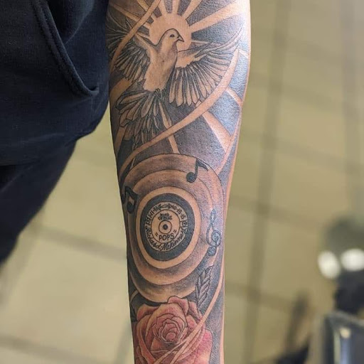 Explore green tattoo ideas, creative tattoo ideas in White Cloud, available at Mikeys Ink