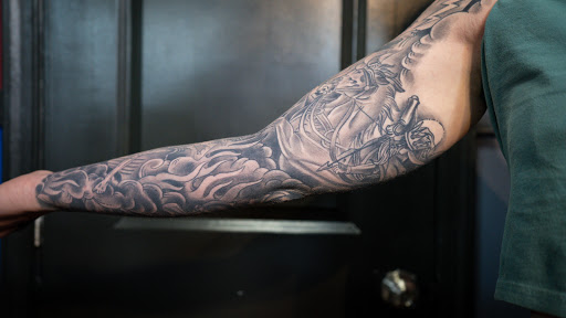 Explore christian tattoos ideas, creative tattoo ideas in Virginia Beach, available at World Famous Blue Horseshoe Tattoo and Piercing Independence