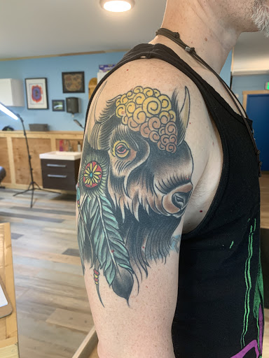 Explore blue flame tattoo ideas, creative tattoo ideas in Powell, available at Hummingbird Tattoo Studio