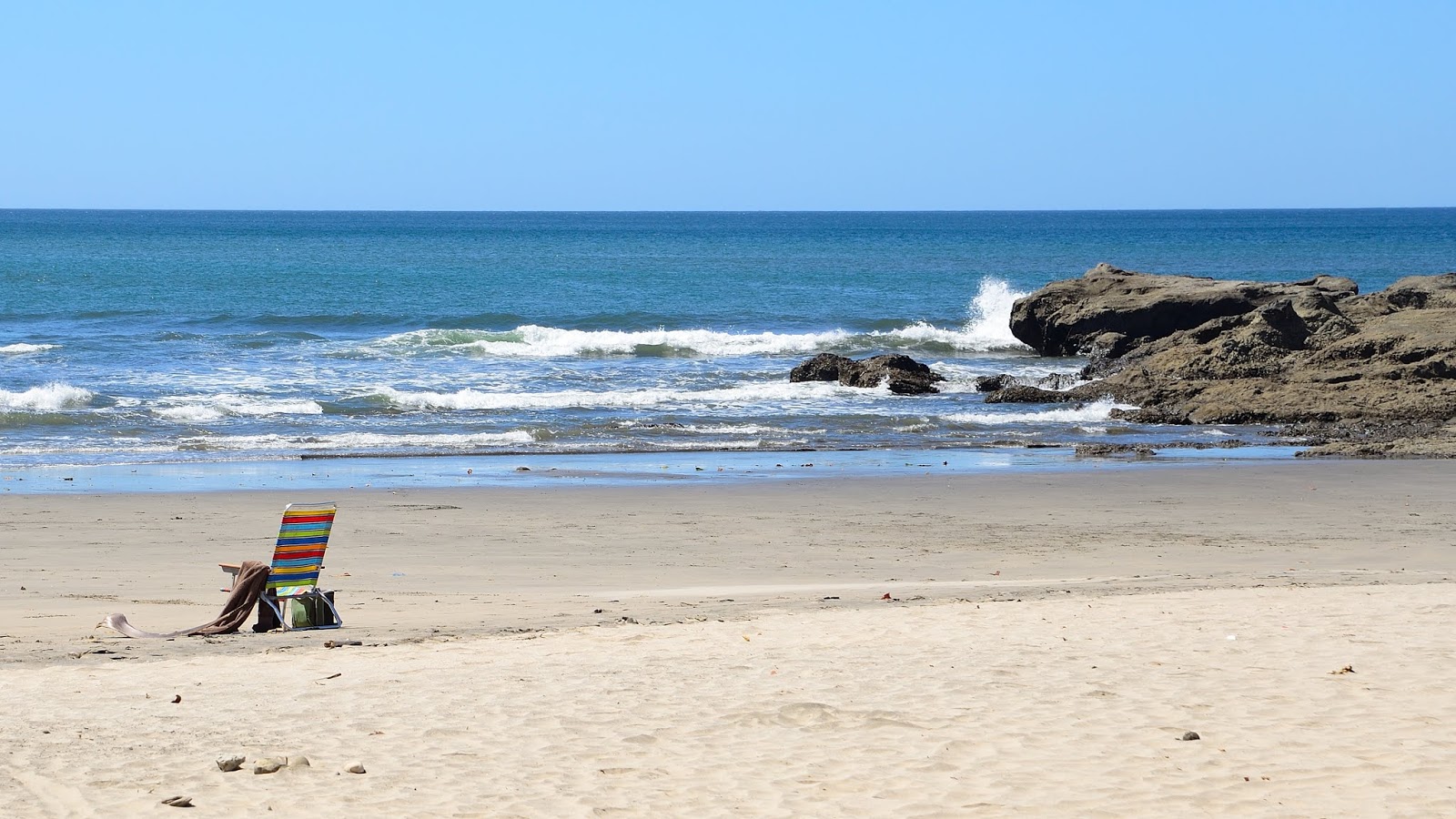 Foto av Playa Pelada med lång rak strand