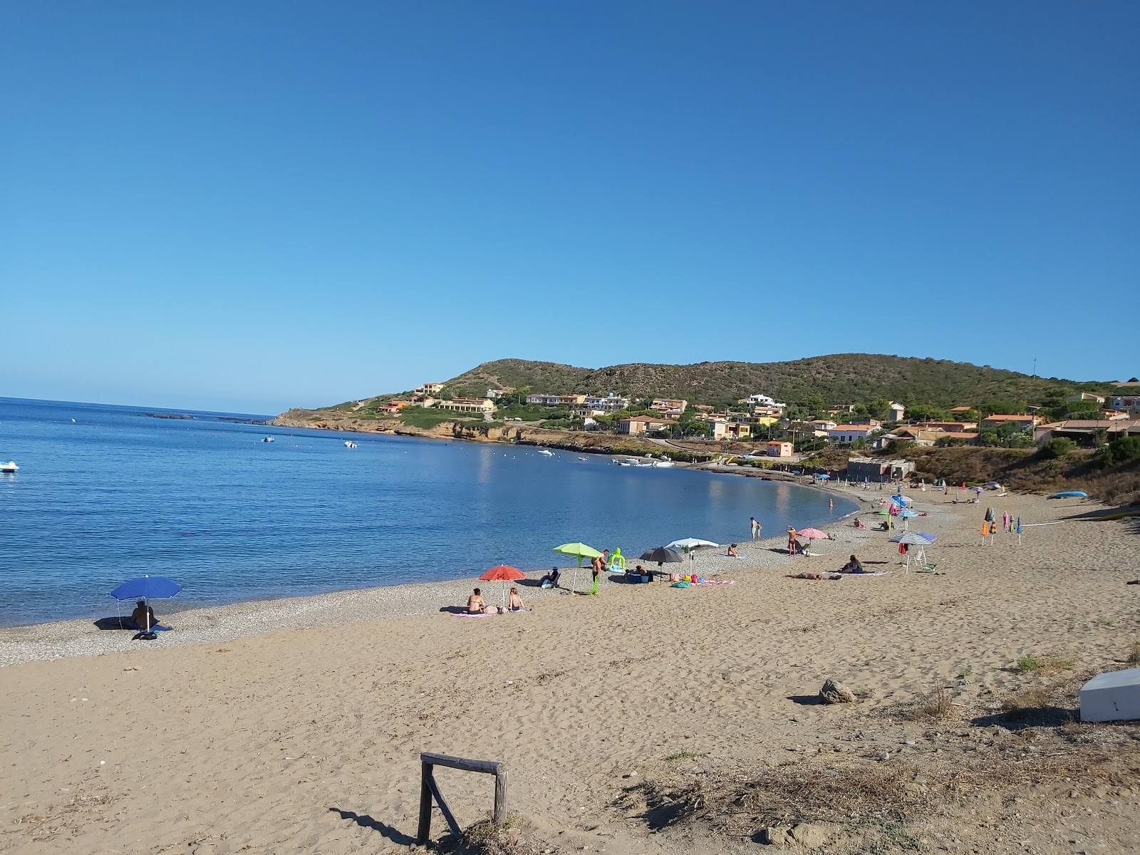 Foto von Porto Palma Beach mit beiger sand & kies Oberfläche