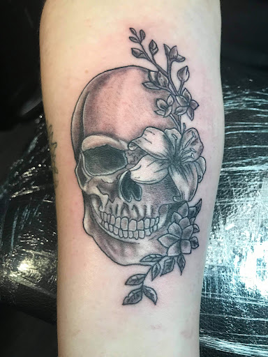 Find flower thigh tattoo ideas for your next unique tattoo in Halethorpe at Razors Edge Tattoo And Piercing Studio