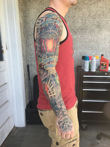 Explore rose tattoo ideas for guys, creative tattoo ideas in Milford, available at Golden Hammer Tattoo Studios