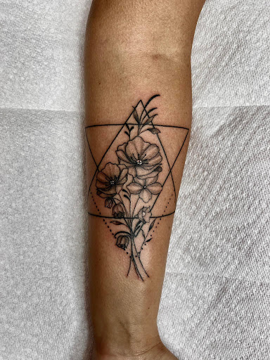Explore feminine shoulder tattoo ideas, creative tattoo ideas in Lake City, available at Crooked Spines Tattoo Studio