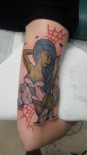 Explore badass tattoo ideas for men, creative tattoo ideas in Spencer, available at Ink Envy Tattoo And Body Piercing