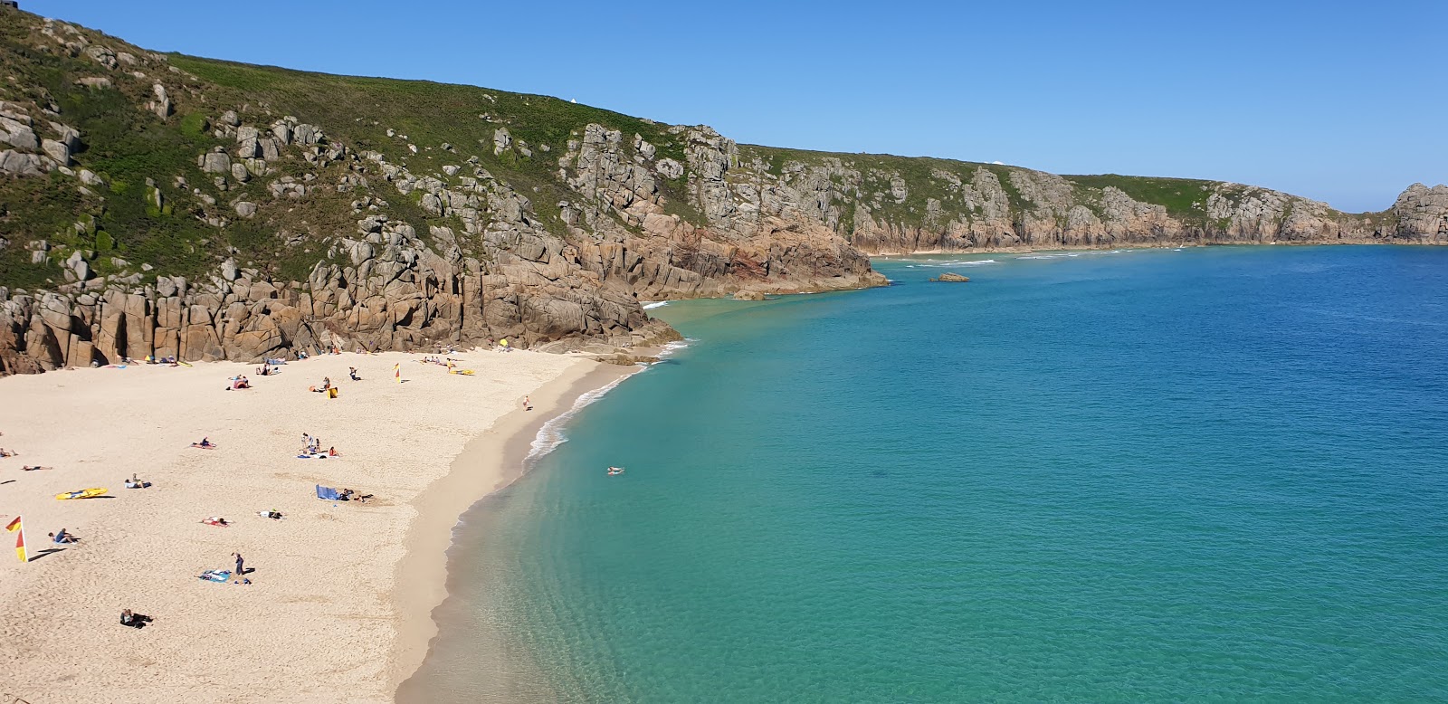 Photo of Porthtowan beach with bright sand surface