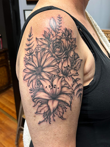Explore women's leg sleeve tattoo ideas, creative tattoo ideas in Kirksville, available at Bedford Legacy Tattoo and Body Piercing