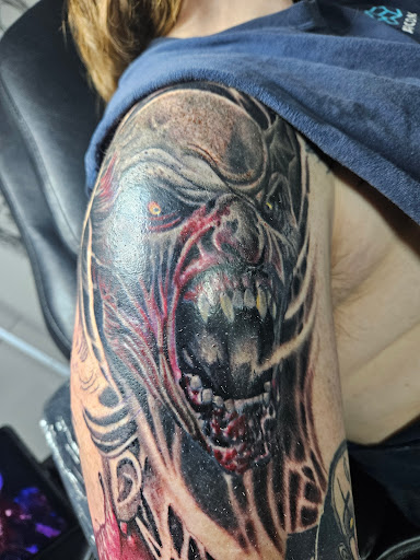 Explore half sleeve tattoo sleeve ideas, creative tattoo ideas in Angola, available at Hoodlum Ink