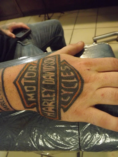 Explore family crest tattoo ideas, creative tattoo ideas in Princeton, available at Custom Dreams Tattooing and Body Piercing