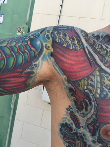 Explore zodiac tattoo ideas for men, creative tattoo ideas in Jacksonville, available at Electric Legacy Tattoo