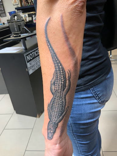 Explore head tattoo ideas for men, creative tattoo ideas in Sarasota, available at SEVEN SINS Tattoo Studio