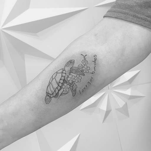 Explore thigh tattoo ideas for women, creative tattoo ideas in Fairfax, available at Pinky Inky Tattoo