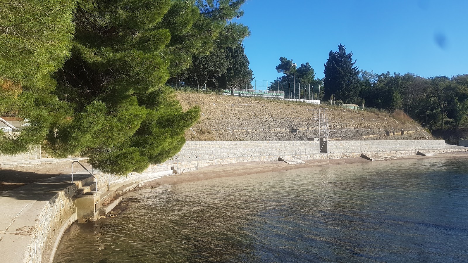 Photo of Debeli rtic beach with concrete cover surface