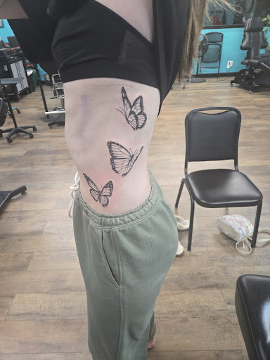 Explore cool hand tattoo ideas for guys, creative tattoo ideas in Wichita, available at Addictions In Ink