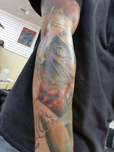 Explore hand finger tattoo ideas, creative tattoo ideas in Rochester, available at Sacred Heart Studios