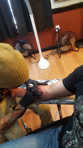 Find wolf tattoo ideas for females for your next unique tattoo in Tarpon Springs at Legendary Custom Tattoos and Piercings