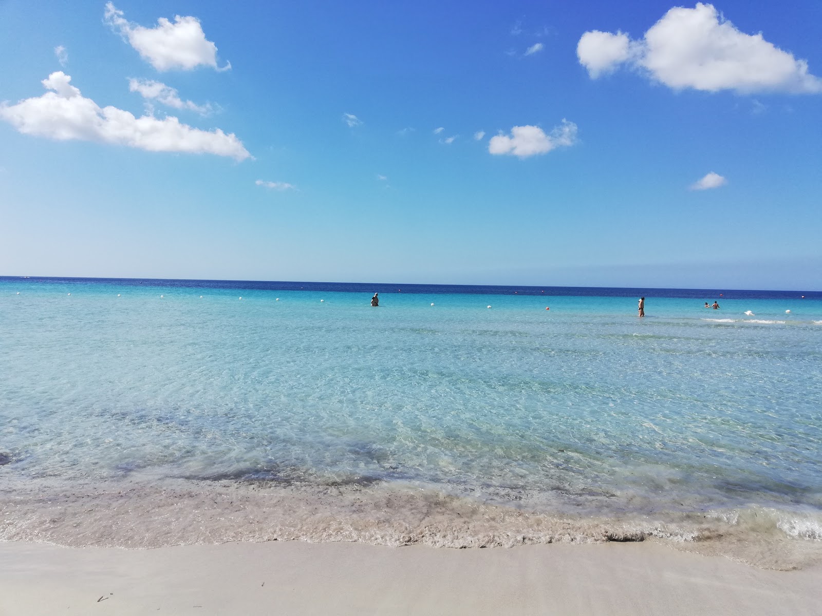 Photo of Lido Beach with turquoise pure water surface