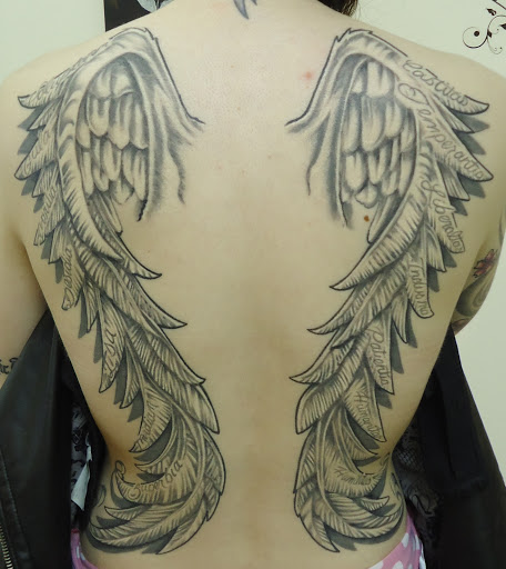 Explore ladies back tattoo ideas, creative tattoo ideas in Auburn, available at Moms Piercing And Tattoos