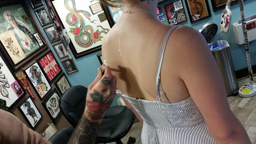 Explore cross hand tattoo ideas, creative tattoo ideas in Buffalo, available at Modern Love