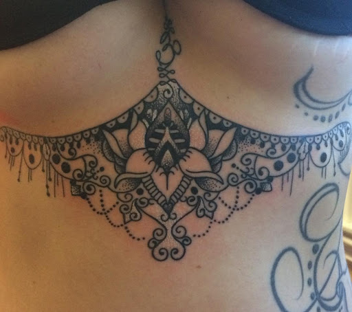 Explore chest tattoo idea, creative tattoo ideas in Chapel Hill, available at Golden Falcon Tattoo and Piercing