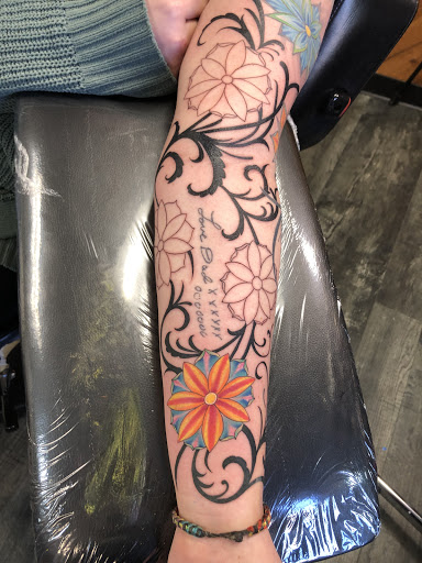 Explore semicolon tattoo ideas for females, creative tattoo ideas in Des Moines, available at Skin Kitchen Tattoo