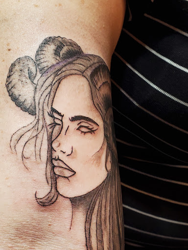 Explore tattoo ideas for women's lower back, creative tattoo ideas in Albuquerque, available at Iron Anchor Tattoo Parlour