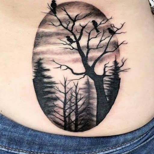 Explore tramp stamp tattoo ideas, creative tattoo ideas in Elko, available at Tom Custom Tattoos and Body Piercing Studio