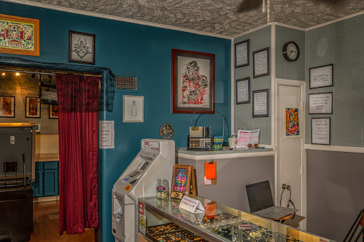 Explore hand poke tattoo ideas, creative tattoo ideas in Omaha, available at Liquid Courage Tattoos