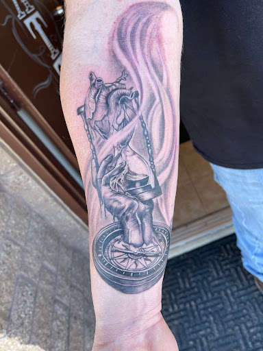 Explore minimalist dog tattoo ideas, creative tattoo ideas in Elko, available at Freedom Tattoo