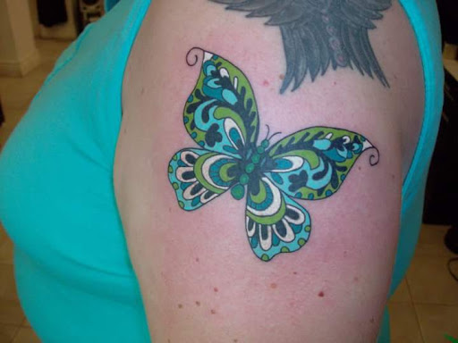 Explore small owl tattoo ideas, creative tattoo ideas in Bridgeport, available at Pike Street Studios Tattoo and Body Piercing