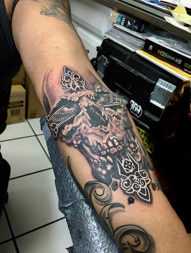 Explore ankle flower tattoo ideas, creative tattoo ideas in Fresno, available at Red Wave Tattoo & Art Gallery