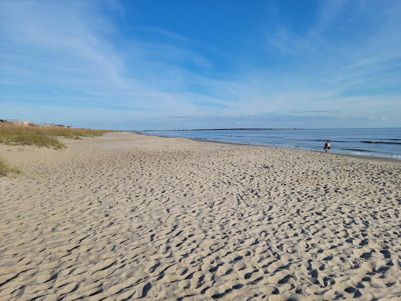 Foto von Caswell beach mit beiger sand Oberfläche