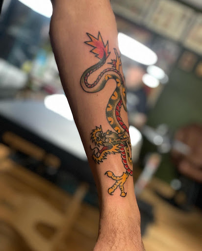 Explore traditional elbow tattoo ideas, creative tattoo ideas in Lake Villa, available at Eternal Tiger Tattoo