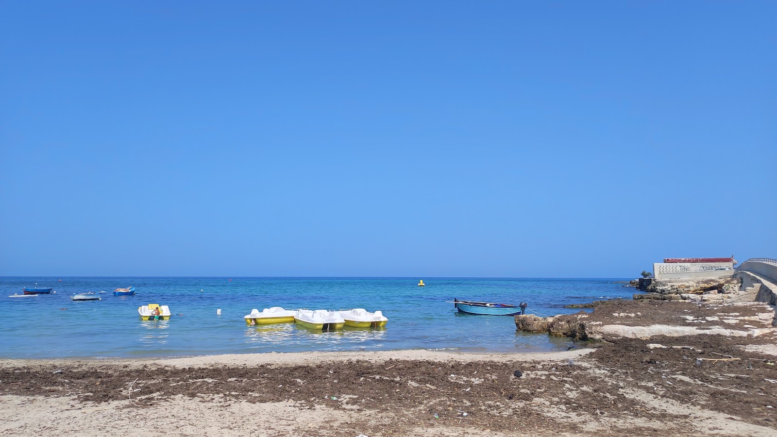 Foto di Cala San Giorgio Beach con una superficie del sabbia beige