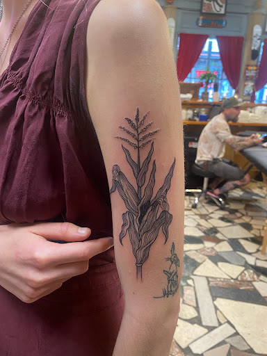 Explore graduation tattoo ideas, creative tattoo ideas in New Orleans, available at Downtown Tattoos and Piercing