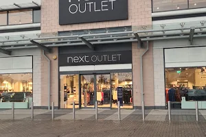Next Outlet image