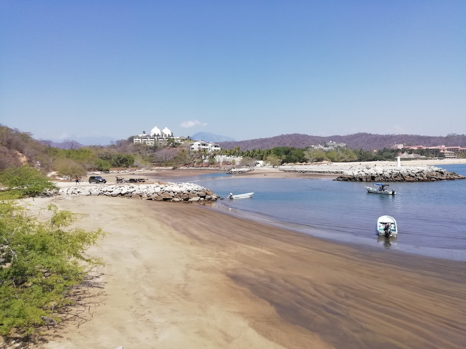 Fotografija Fishermans beach z rjava voda površino