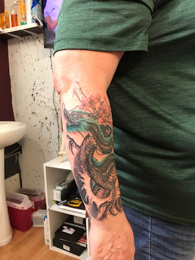 Explore tattoo ideas for women leg, creative tattoo ideas in Milwaukee, available at West Allis Tattoo & Gallery Tattoo Shop Milwaukee