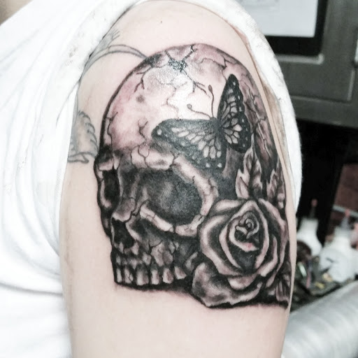 Explore throat tattoo ideas for men, creative tattoo ideas in Erie, available at EliKingInk