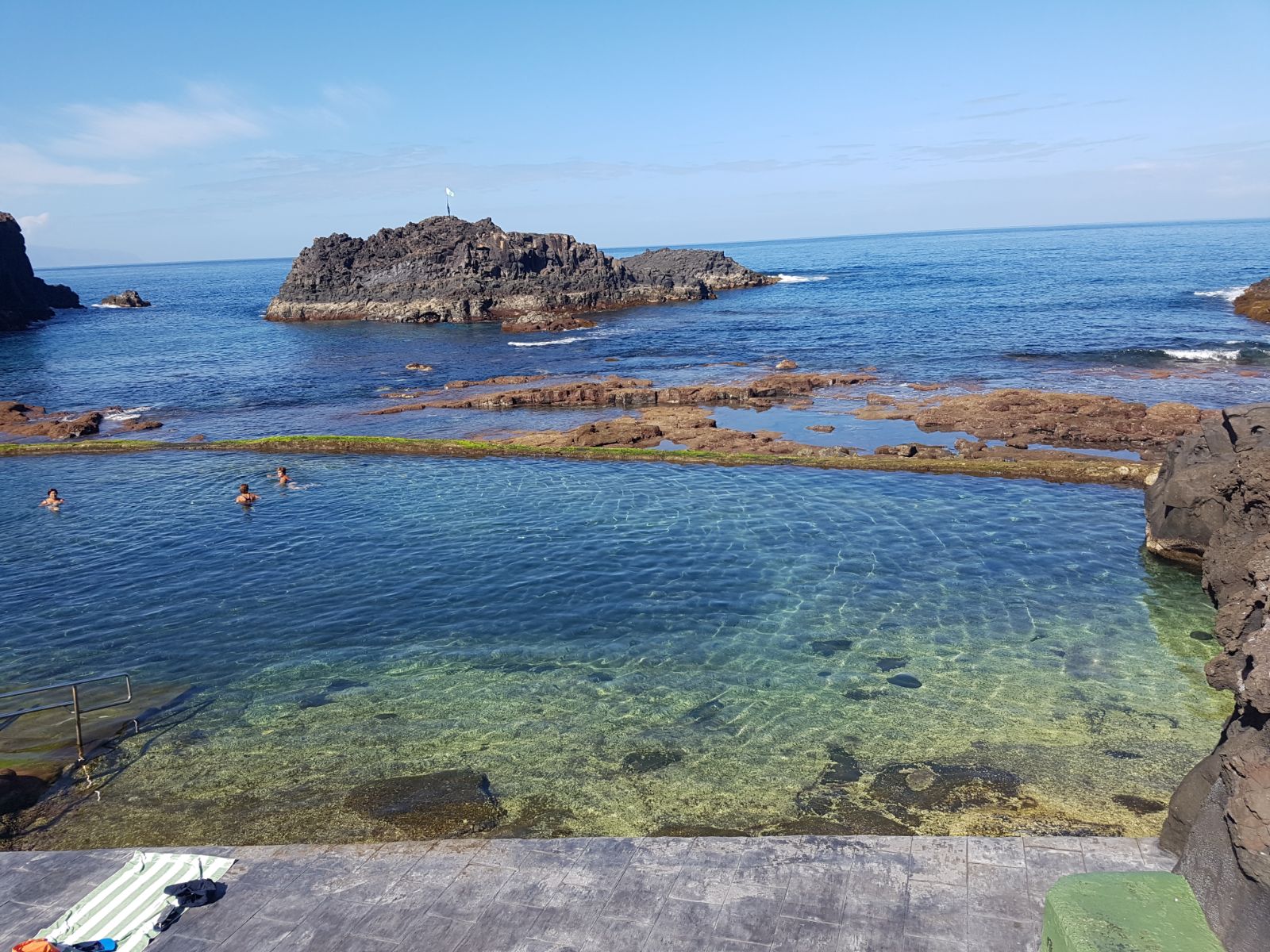 Photo of Natural pool el Pris with blue pure water surface