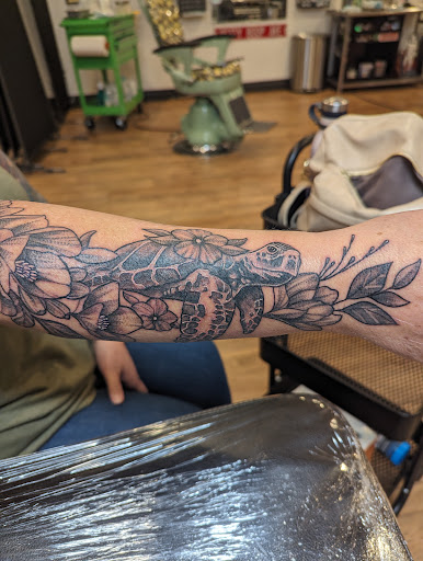 Explore red ink tattoo ideas for guys, creative tattoo ideas in Redding, available at Caddy Daddys