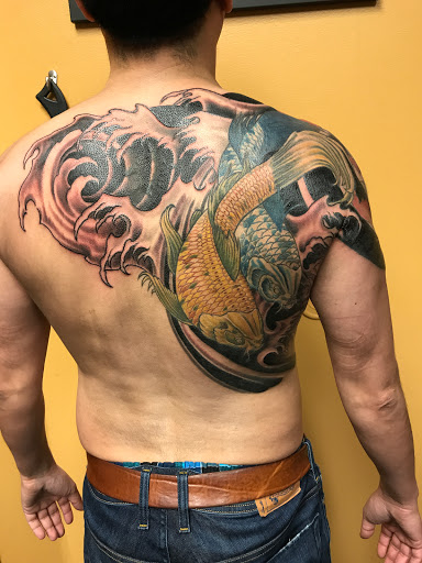 Explore back of shoulder tattoo ideas, creative tattoo ideas in Addison, available at Cat Tattoo