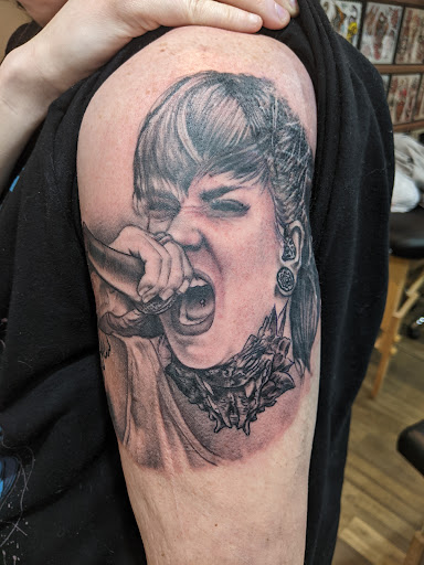 Explore rubber duck tattoo ideas, creative tattoo ideas in Pikeville, available at Sacred Mountain Tattoo