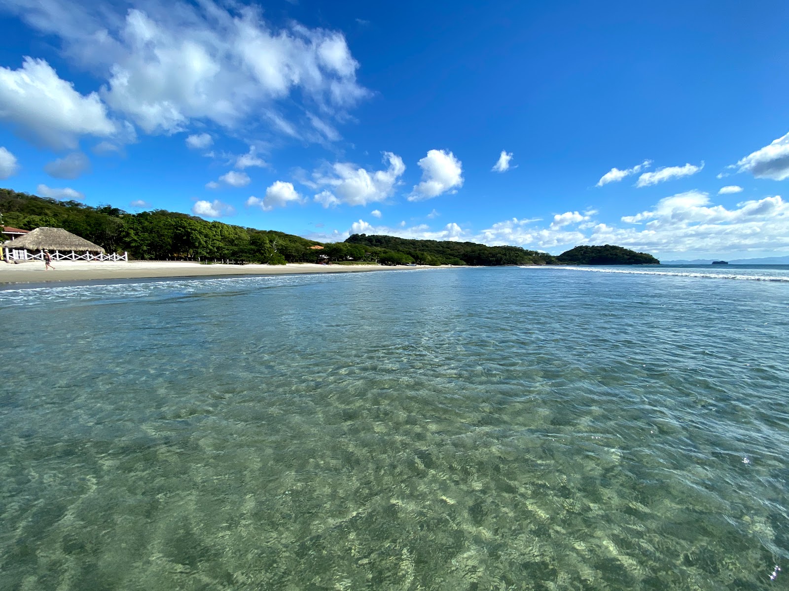 Foto de Praia El Coco com areia bege superfície