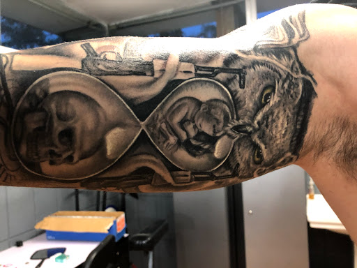 Explore dystopian tattoo ideas, creative tattoo ideas in Sarasota, available at SEVEN SINS Tattoo Studio