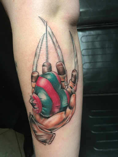 Explore peacock feather tattoo ideas, creative tattoo ideas in Bedford, available at Evolution Tattoo & Body piercing