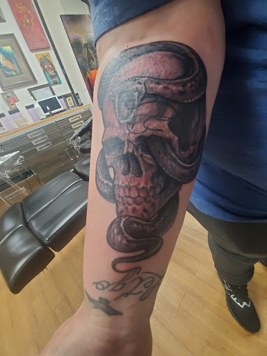 Explore man hand tattoo ideas, creative tattoo ideas in Sioux City, available at Living Art Tattoo Studio